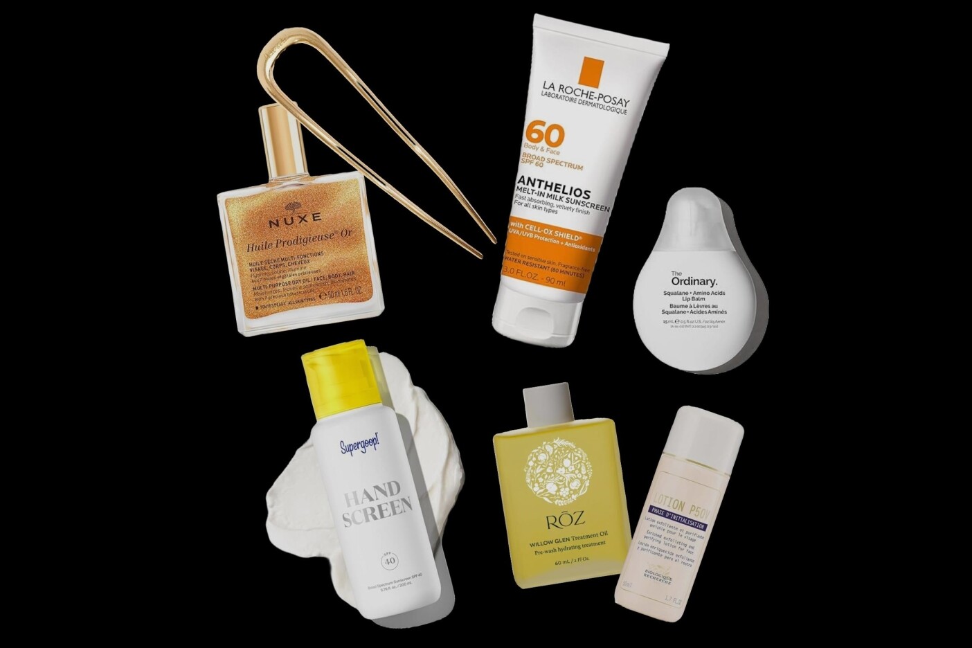 A flat lay of six skincare and beauty products, including sunscreen, lotion, oil, and a hairpin—perfect Summer Essentials for 2025—arranged on a sleek black background.